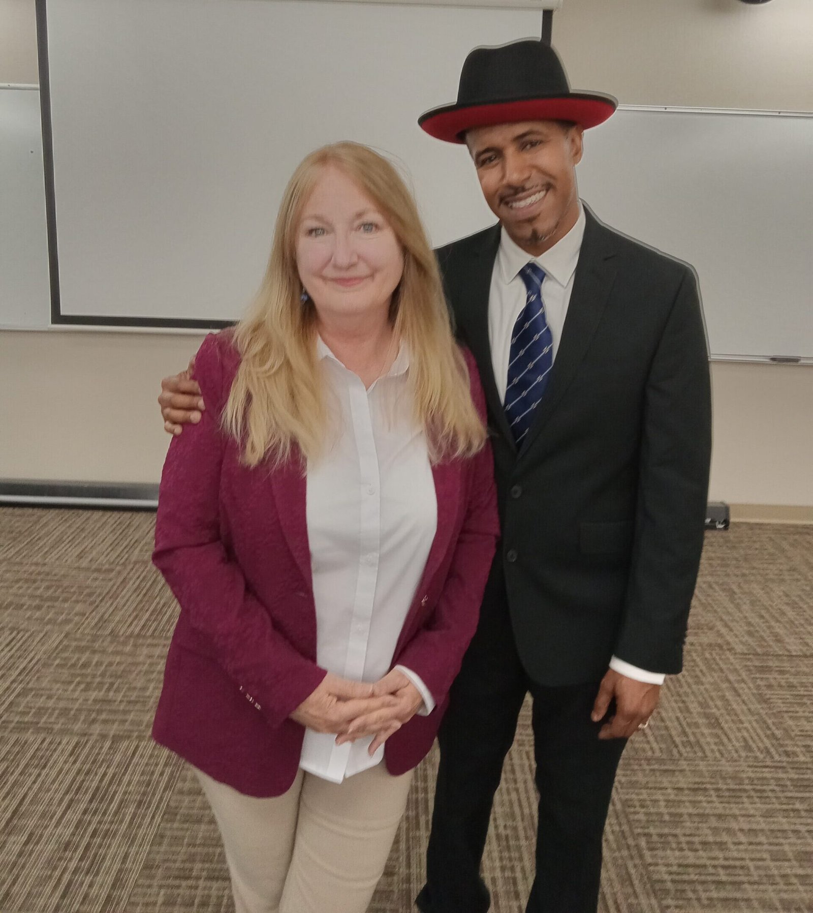 Kelly Morris, MBA of BeUncommon 24-7 with Susie Pryor, PhD, Regional Director of Central California SBDC at the SBDC of the Year Award Ceremony 2025
