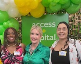 Korey Morris, CEO of BeUncommon 24-7, standing with Cheryl Flowers of FlowSynergy and Dawn Golik, SBA Fresno District Director.