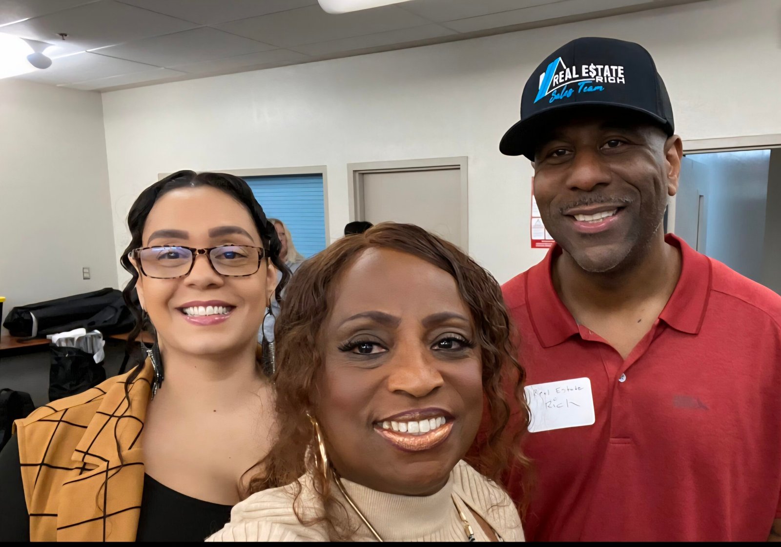 Korey Morris, CEO of BeUncommon 24-7, with Cheryl Flowers of FlowSynergy and Rich Jackson, real estate professional, at the Growth Surge Bootcamp.